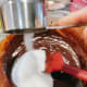 Add the sugar into the mixture. Stir to combine.