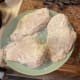 The breaded pieces of chicken. Notice how they are uniform in the flour coverage. To prevent burning make sure all excess flour is knocked off.