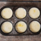 Put a cupcake pan or 6 to 8 baking cups in a 2 1/2 inch pan. Pour custard into the cupcake pan or baking cups. Fill large pan with enough water to reach the rim of the cupcake pan or baking cups.