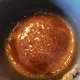 Combine corn syrup and brown sugar in a saucepan. Cook over medium heat, stirring frequently, until the mixture bubbles.