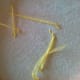 Don't do this. Tie off floss instead of stretching across your fabric.