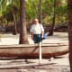 Old Hawaiian canoe & my hubby at Place of Refuge on Big Island of Hawaii