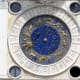 A close-up of the clock on the tower. Note the astrological symbols and the moon phases.