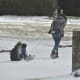 A homemade sled is in use on our street for two little neighbor kids.