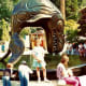 My niece standing under the Orca statue in Stanley Park