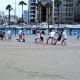 Tug-of-war on Playa de las Alcaravaneras.