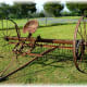 An old harrow farm implement used as decor.