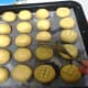 Making tic tac toe lines on the tarts using the back of a fork