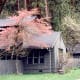 House adorned with spring blooming trees on valley floor