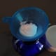 Hyaluronate powder in a funnel.