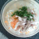 Roast chicken and coriander is added to salad