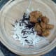 Mixing turnip and sausage salad