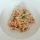 Roast chicken and white turnip salad is assembled on serving plate