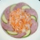 White turnip and carrot salad is arranged in the centre of the plate