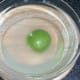 Cored apple is steeped in water and lemon juice