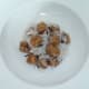 Turnip and sausage salad is arranged on serving plate
