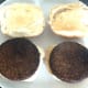 Vegan burgers are laid on toasted rolls