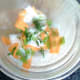 Shredded basil leaves are added to pickled salad