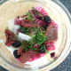 Sun dried tomatoes, olives, basil and seasonings are added to salad