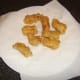 Cod goujons are drained on kitchen paper