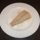 Skin side of cod is patted in seasoned flour