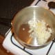 Onions and garlic are softened in vegetable oil