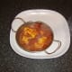 Cod fish curry is served in a heated dish
