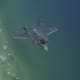 A U.S. Air Force F-35A Lightning II aircraft assigned to the 58th Fighter Squadron, 33rd Fighter Wing (FW) at Eglin Air Force Base, Fla., flies over the coast of Fort Walton Beach, Fla., May 16, 2013. The 33rd FW trained Air Force, Marine Corps, Navy