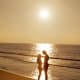 Couple on the beach at sunset
