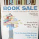 This sign was on a person-sized, cut-out figure (see below). As you walked into the library's lobby, you couldn't miss it. Great advertisement.