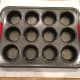Step 1: Grease mini muffin pan.