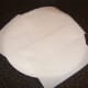 Kitchen paper is spread on a plate for draining chips