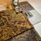 Fold 1 1/2 to 2 inches of your strip and stitch. This is where you will begin stitching to the top piece.
