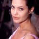 Originally, Angelina had a tribal dragon on her left upper arm. Then she added "Billie Bob" for her second husband.