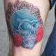skull tattoos and flowers