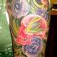 skull tattoos and flowers