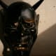 A carved black hannya mask.