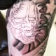 A black and gray hannya tattoo.