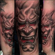This hannya tattoo has a devilish appearance.
