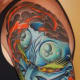 A blue hannya mask tattoo.