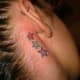stars tattooed behind someone's ears
