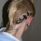 birds behind a person's ear
