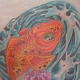 Here is Crystal's finished koi tattoo, now with all of the colors and shading done.