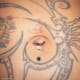 True navel piercing of an outie belly button