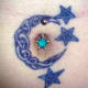 A moon-shaped knot around a bellybutton piercing. (Devil Bitch, Barnsley, UK