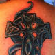 A blue cross. (by Seb Leroy, Hell funky's tattoo, 1A Findlater place (Off Marlborough St.) Dublin 1. Dublin ireland)
