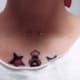 A Typical Neck Piercing Among Tattoos