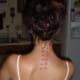 A Column of Nape Piercings