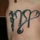 This tattoo depicts the Virgo sign.