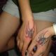 Black widows on hands